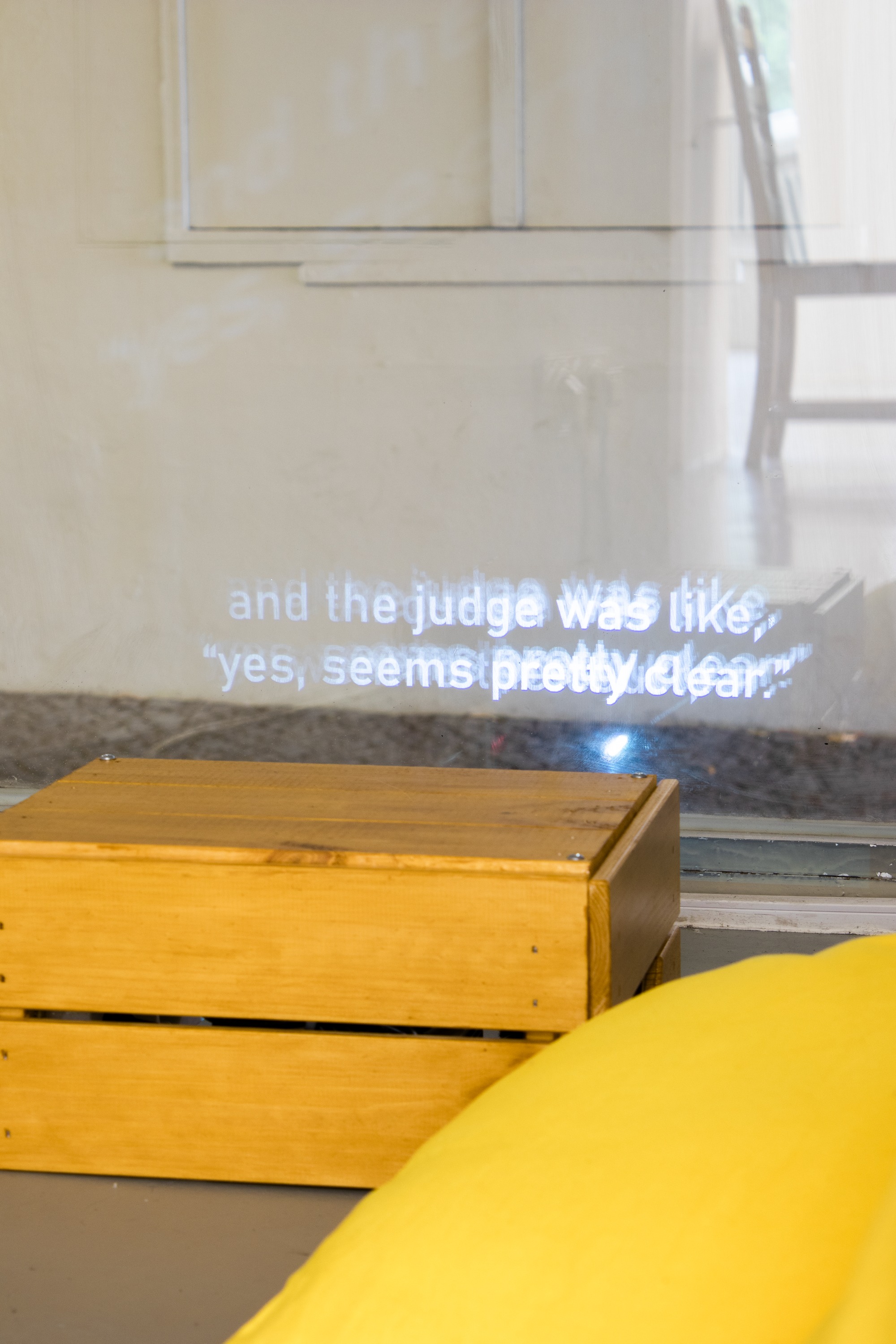 Close-up of the projection on the window, with the words, 